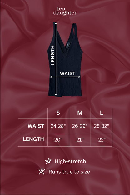 Black tank top with measurement chart on a red satin background